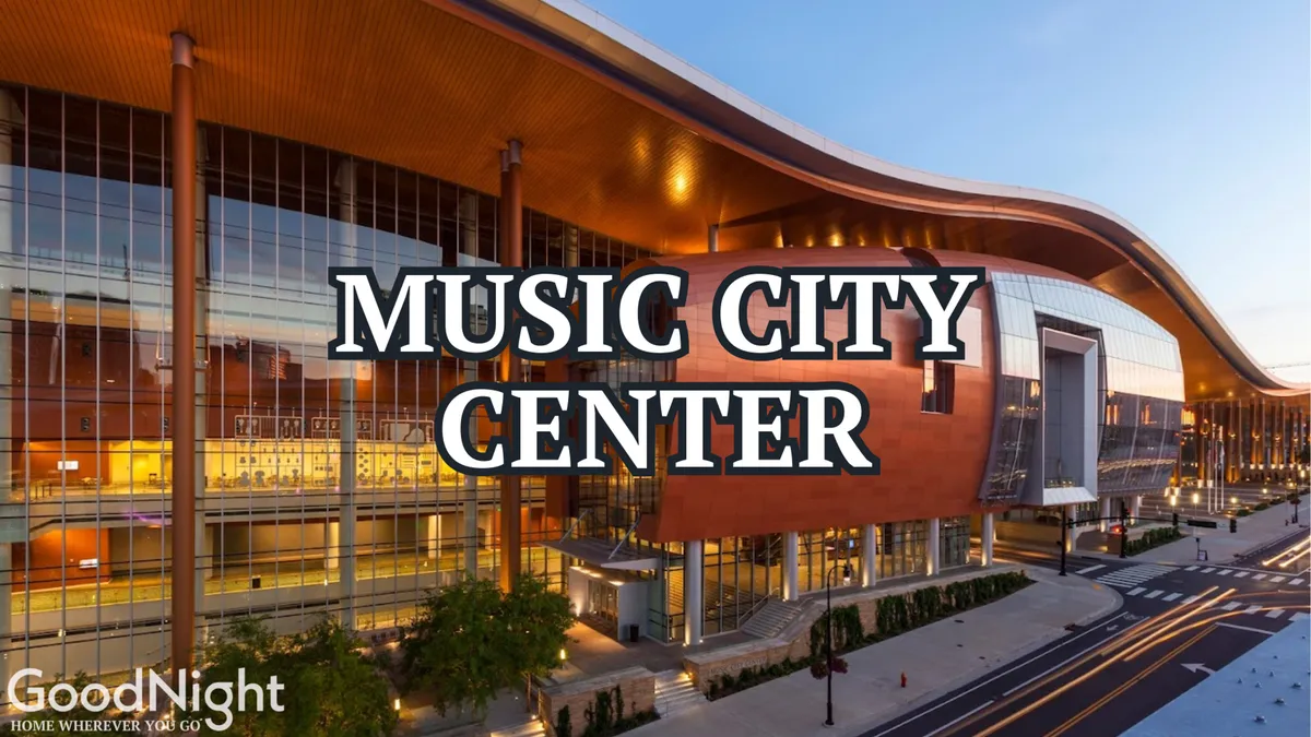 This image showcases the iconic Music City Center with its dramatic curved roofline, large glass windows, and surrounding landscaping, capturing the heart of Nashville's business and convention scene.