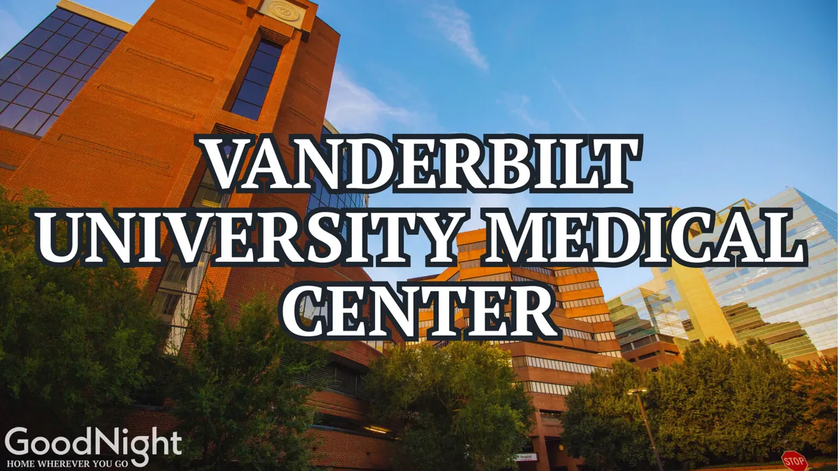 A prominent view of Vanderbilt University Medical Center, surrounded by greenery with the city skyline in the distance, representing both the area's top healthcare institutions and its dynamic urban setting.